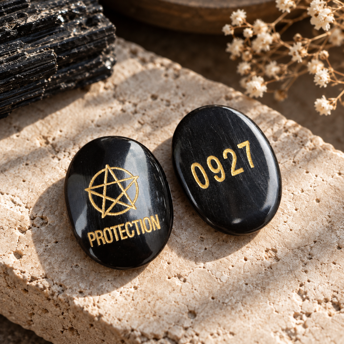 Kavach Black Tourmaline protection Zibu coin with a gold-tone protection symbol on one side and the engraved number 0927 on the other by House of AAKAASHI.