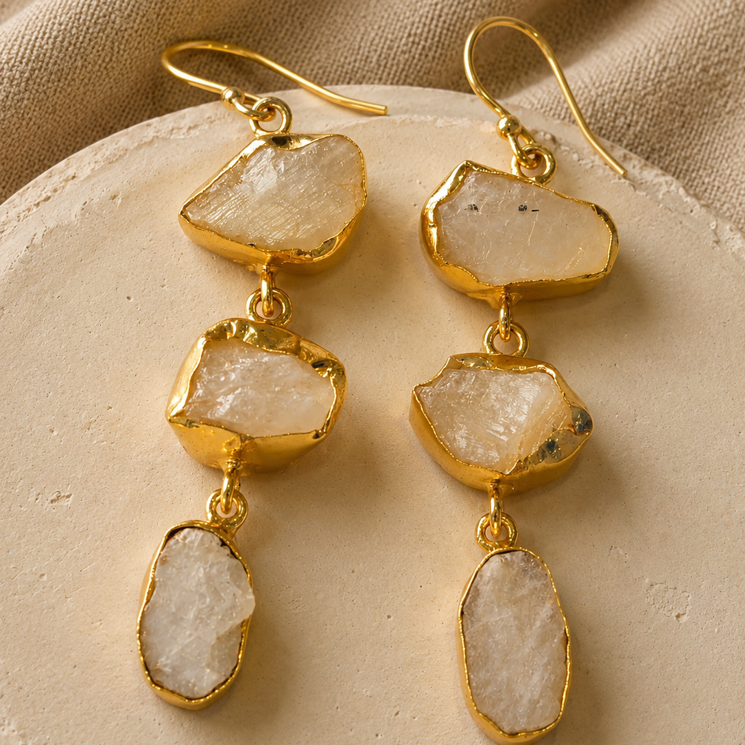Eira raw Moonstone cascade earrings featuring three natural freeform gemstones in 18K gold-plated brass by House of AAKAASHI