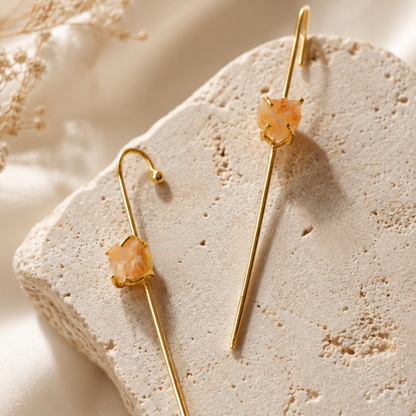 Saanvi raw Carnelian ear cuff featuring a natural orange-red crystal and elongated 18K gold-plated brass design by House of AAKAASHI