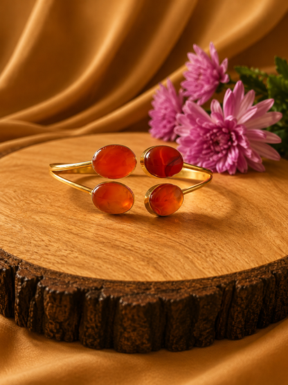 Rohini Carnelian open cuff bracelet with four polished orange-red cabochon gemstones in 18K gold-plated brass by House of AAKAASHI